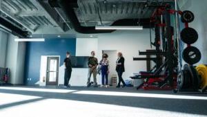 People stand inside a fitness space in Shenandoah University's new Wilkins Health & Fitness Suite.